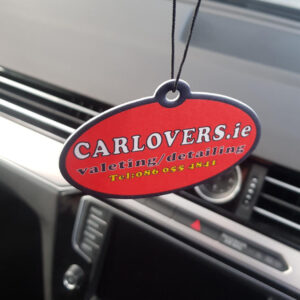 Car Lovers air freshener hanging in a car