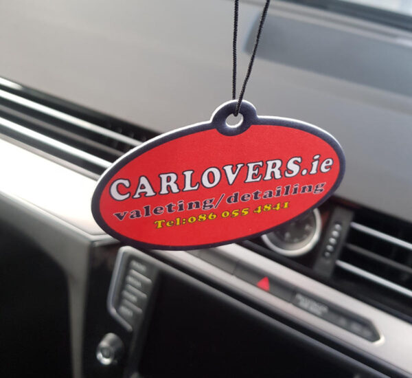 Car Lovers air freshener hanging in a car